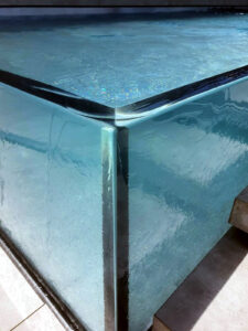 corner of a glass pool 